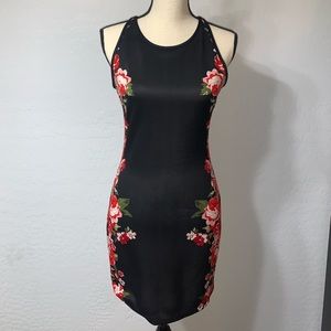 Black fitted dress with flower details